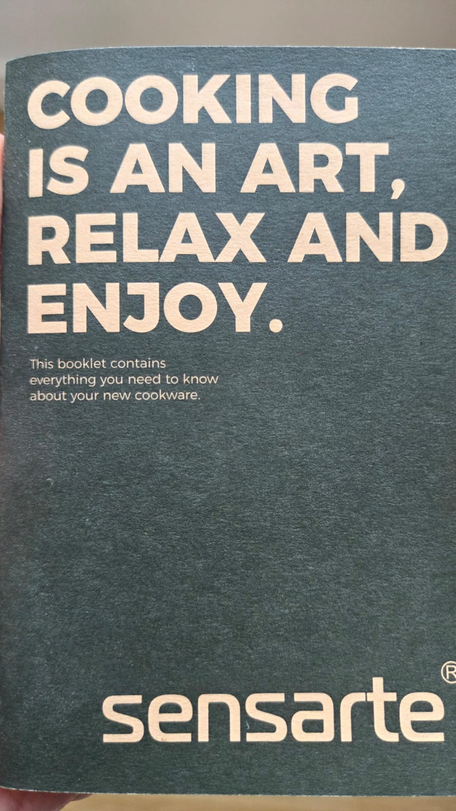 The cover of the Sensarte cookware booklet, reading "Cooking is an art, relax and enjoy"
