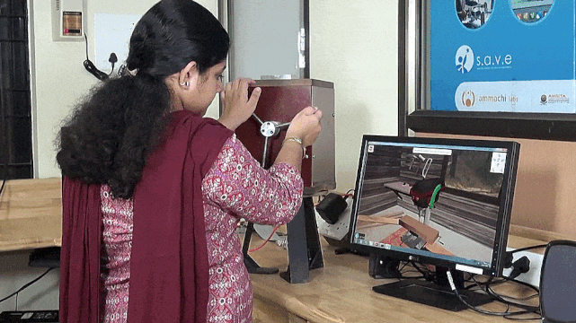User trains in the use of a drillpress with haptic feedback.